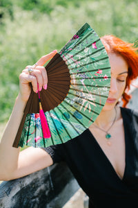 Green hand-held silk fan with 'Greenery' mushroom and crystal botanical artwork
