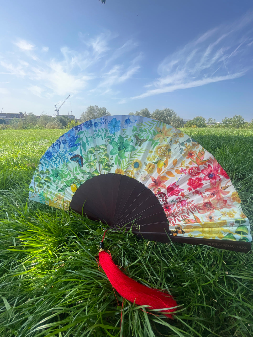 Colourful Silk folding hand fan 'kaleido-bloom' print with floral & nature filled rainbow design