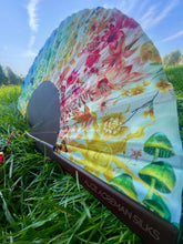 Load image into Gallery viewer, Colourful Silk folding hand fan &#39;kaleido-bloom&#39; print with floral &amp; nature filled rainbow design