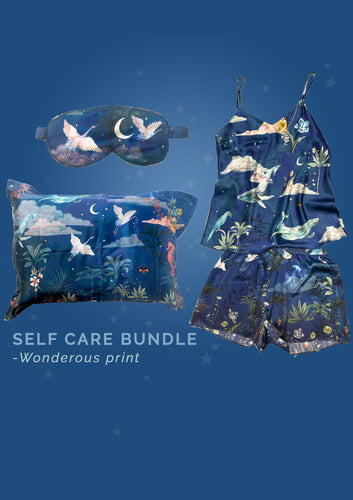Luxury self-care gift bundle: Blue silk pyjama set, pillowcase and eye mask in 'Wonderous' Print