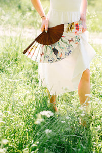 Floral Silk Fan with Toucan design and luxurious Gold tassel, part of the Mysa Collection