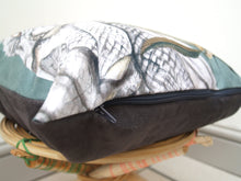 Load image into Gallery viewer, Sage Green Cushion with golden yellow reptile illustration, &#39;Bask&#39; design made from soft Vegan friendly suede fabric