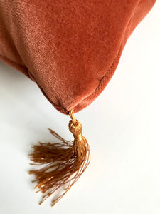 Velvet Cushion 'Flow' in Rust colour with gold tassels, rectangular shape and feather filling