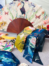 Load image into Gallery viewer, Floral Silk Fan with Toucan design and luxurious Gold tassel, part of the Mysa Collection